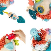 Plush sensory reef toy pieces with textured sea animal faces and soft fabric parts