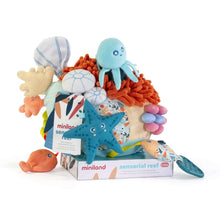 Plush sensory reef toy with octopus, starfish, and orange pom pom textured parts