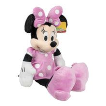 Pink Minnie Mouse plush toy in polka-dot dress, seated with arms out