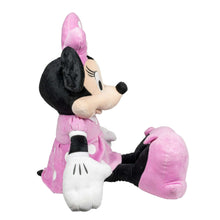 Minnie Mouse plush toy in pink dress, side view with one leg extended