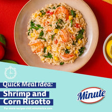 Shrimp and corn risotto in a bowl with a few broccoli bits and shrimp pieces