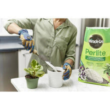 Perlite amendment bag on table as perlite is added to potted plants