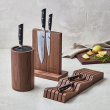 Chef knives in wooden block with Damascus blades and black handles