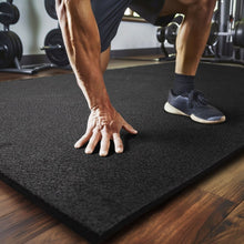 All-purpose black rubber mat with textured surface for gym or work areas