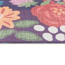 Floral kitchen mat edge with stitched border on navy and pastel leaf/petal print