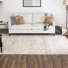 Light beige and gray area rug with distressed abstract pattern and flat weave