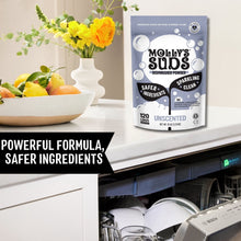 Molly's Suds dishwasher powder pouch on countertop beside open dishwasher rack