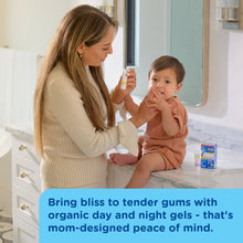 Mom applying baby teething soothing gel to child's gums