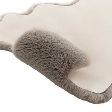 Gray faux fur mini quad rug close-up, scalloped edge, plush shag pile
