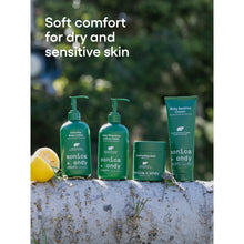 Soothing baby balm jar and matching baby-care bottles outdoors