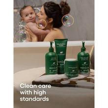 Soothing baby balm jar on bathroom counter with pump bottles nearby