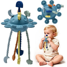 Blue pull-string sensory toy with dangling legs and hanging parts.