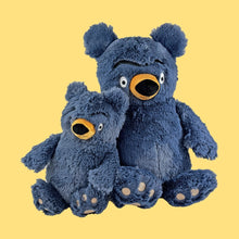 Giant blue plush bear with a smaller blue bear, open mouth, round yellow nose