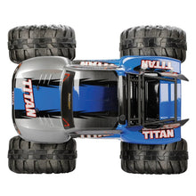 2WD RC truck car, rear view, silver cab with blue side panels and black treaded tires