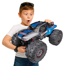 Front view 2WD RC truck car with silver-and-blue body and black off-road tires