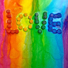 Fizzy bath colors arranged on rainbow stripes: orange, lime, green, teal, blue, purple