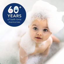 Baby bathing with thick white foam bubbles, head and shoulders visible