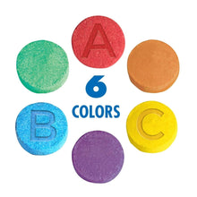 Six round fizzy bath color tablets: red, green, orange, blue, purple, yellow