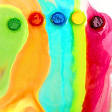 Colorful fizzy bath color bursts in rainbow swirls: green, orange, blue, pink