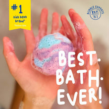 Single bath bomb fizzing in a palm with foam bubbles.