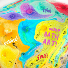 Colorful bathwater with swirling bubbles and fizz from a bath bomb.