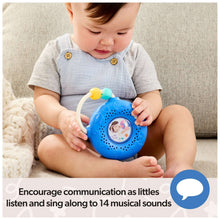 Toddler holding Ms. Rachel electronic sing-along song player, blue round body and soft cord