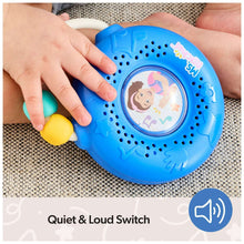 Ms. Rachel electronic sing-along song player held by hands on textured mat, blue body and knobs