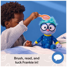 Frankie plush bedtime toy in blue pajamas with teal hood, on blanket