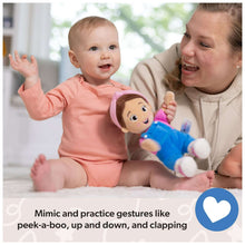 11-inch plush doll in blue overalls with pink hood, held by a parent and baby