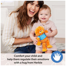 Orange plush cuddle friend with blue shirt and yellow beak, held by a child