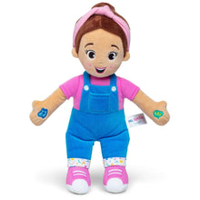 16-inch plush doll with brown skin, pink shirt, blue overalls, pink headband