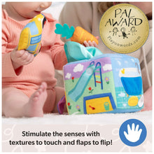 Plush learning cube with colorful fabric panels and small bear and bunny toys