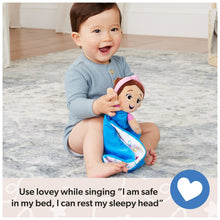 Plush lovey doll with pink hood and blue blanket held by a smiling baby