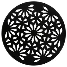 Black round plant caddy top with starburst geometric cutouts
