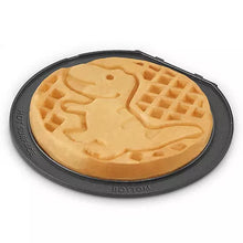Bottom of mini waffle maker plate with animal-shaped waffle pattern