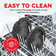 Waffle maker plates in dishwasher rack, showing dinosaur and waffle patterns