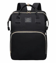 Black diaper bag backpack with top handle, front pocket, and padded shoulder straps
