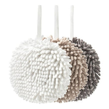 Pair of noodle hand towels with pom-pom loop texture and hanging loops, white and tan