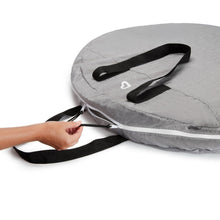 Gray travel carrying case with open top and black shoulder strap