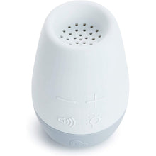White sound machine top with speaker grille and embossed control icons