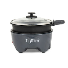 Electric noodle cooker with clear glass lid and side handle, dark gray base