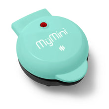 Teal mini waffle maker with red power light on top, closed lid