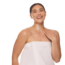 Neck and decollete firming serum use: woman applying to neck and chest