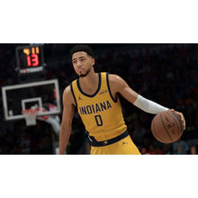 Basketball video game screenshot of a player in yellow Indiana jersey holding ball