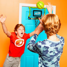 Over-the-door mini basketball hoop with black net and green backboard, with green ball