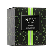 Bamboo scented candle box with NEST logo and green striped accents