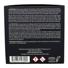 Bamboo scented candle box bottom with warning labels, icons, and product codes
