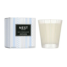 Blue-and-white NEST scented candle gift box with label and striped pattern