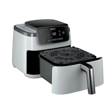 Ninja air fryer with open crisper basket, perforated plate, and black control panel