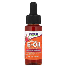 Vitamin E oil bottle with black dropper; red-orange label and amber liquid.
